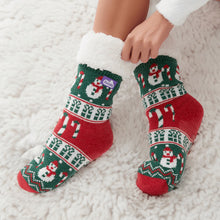 Load image into Gallery viewer, The Foozie™ Christmas Snowman slipper socks, hands pulling up the sherpa cuff on a fluffy white rug