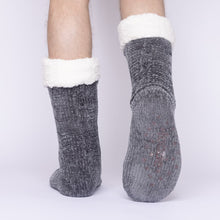 Load image into Gallery viewer, The Foozie™ in Dark Gray, back view worn by a man in Large with one foot raised to show the non-slip grips on the sole