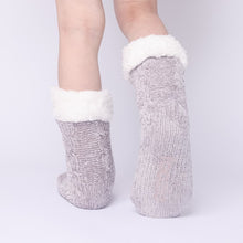 Load image into Gallery viewer, The Foozie™ in Light Gray, back view worn in Kids/Small with one foot raised to show the non-slip grips on the sole
