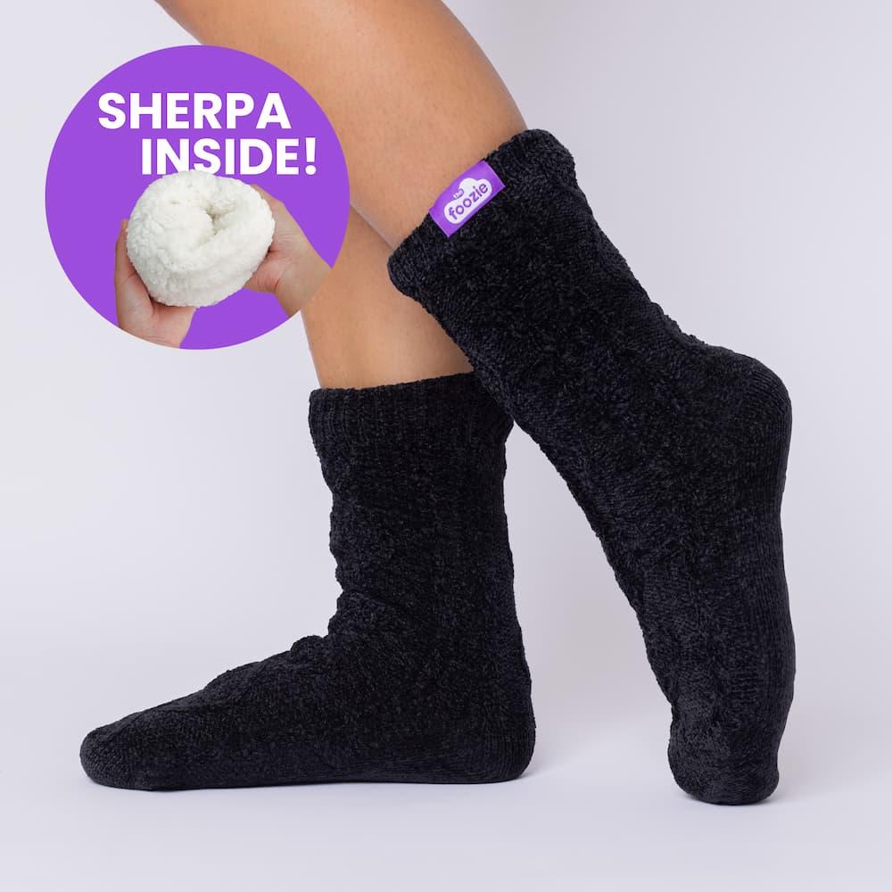The Foozie™ Move in Black, side view on foot with a 'Sherpa inside' badge showing the lining