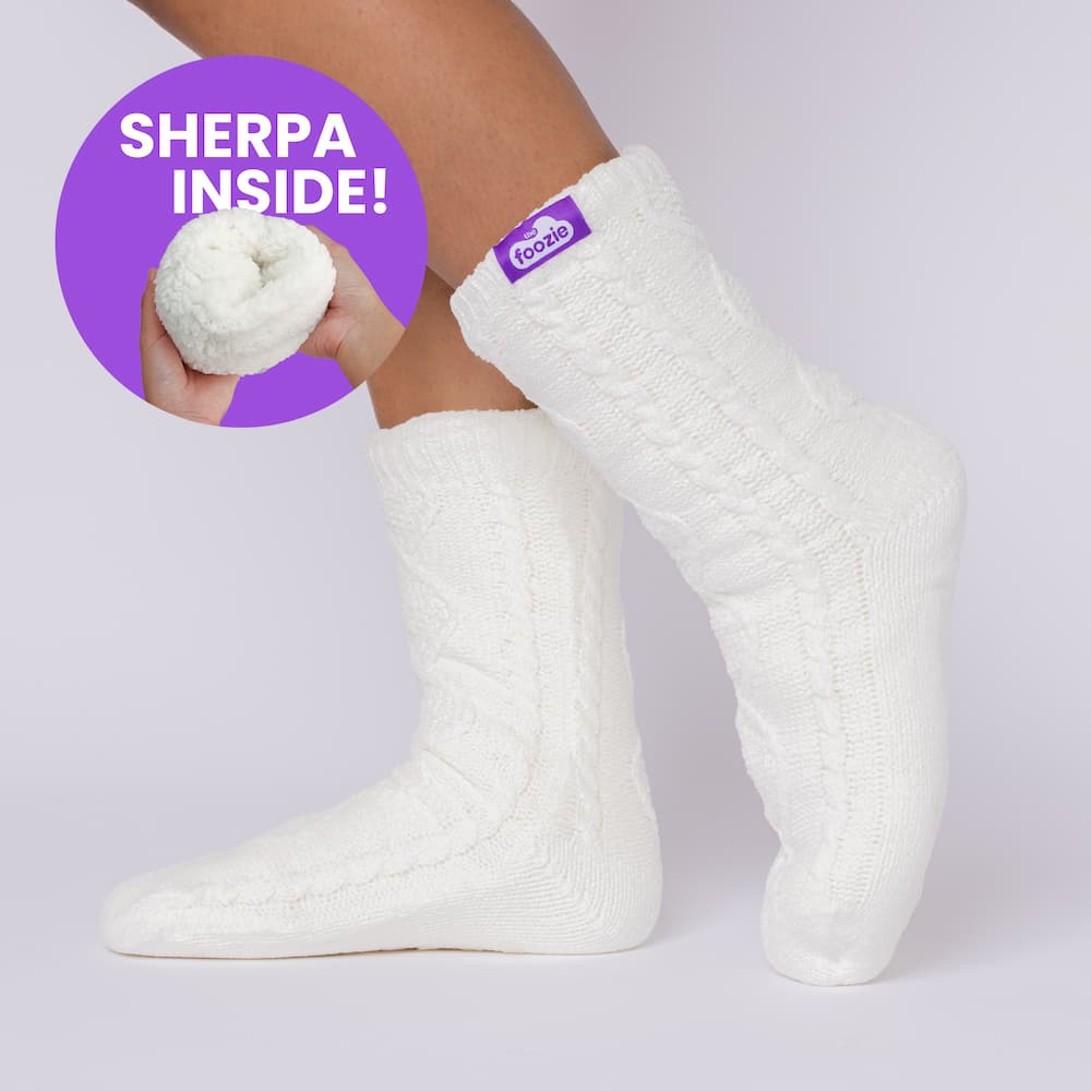 The Foozie™ Move in White, side view on foot with a 'Sherpa inside' badge showing the lining