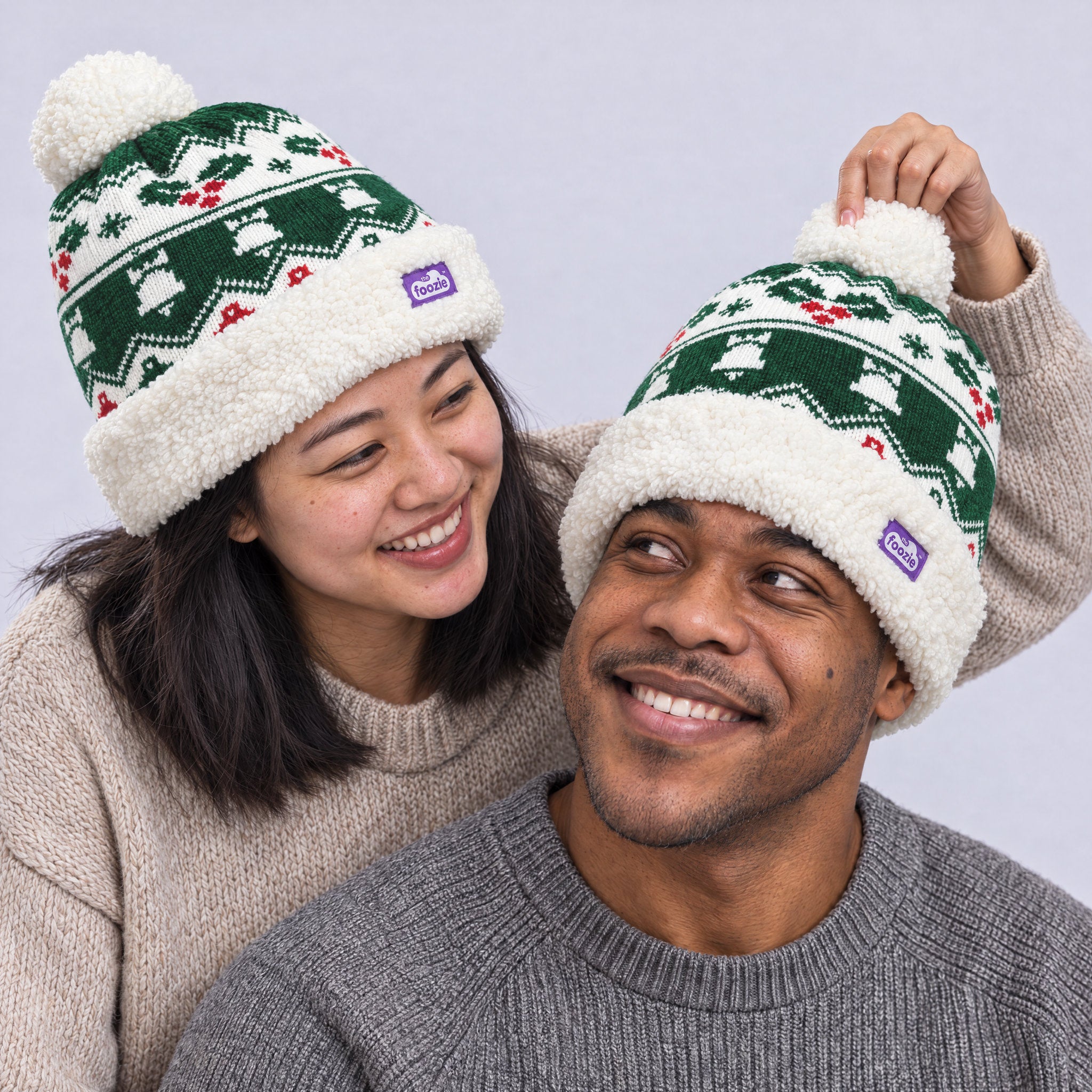 The Foozie™ Holly Christmas Beanie, worn by a couple