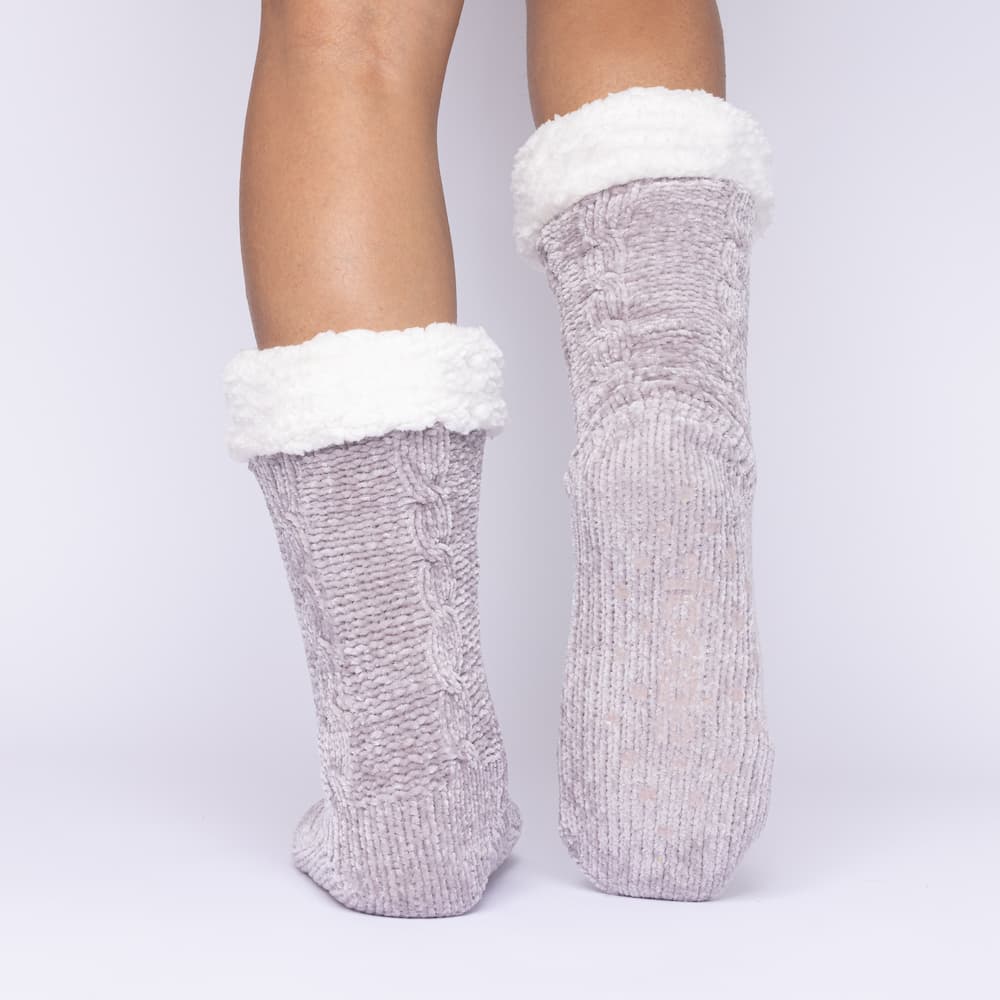 The Foozie™ in Light Gray, back view with one foot raised to show the non-slip grips on the sole