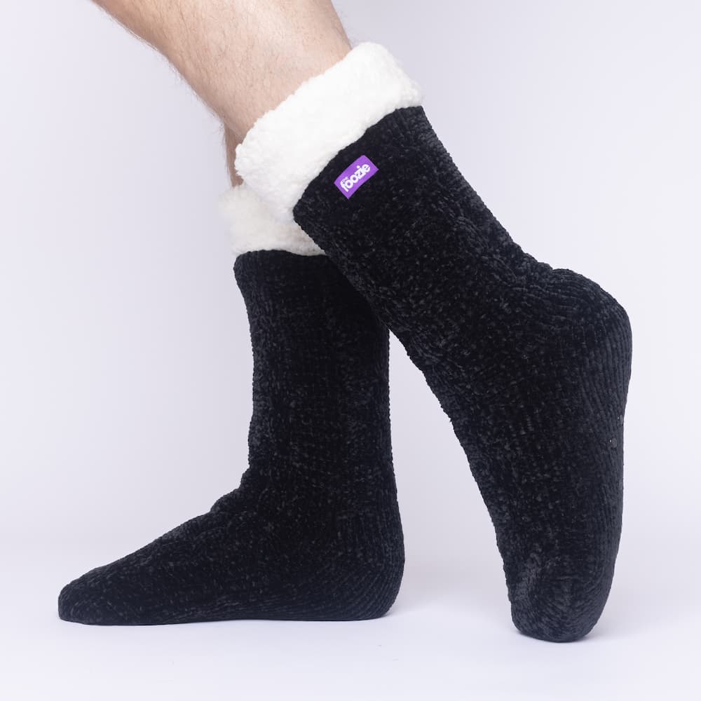 The Foozie™ in Black, side view worn by a man in Large with the sherpa cuff folded down
