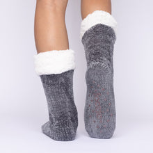 Load image into Gallery viewer, The Foozie™ in Dark Gray, back view with one foot raised to show the non-slip grips on the sole
