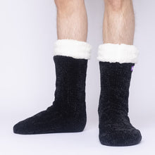 Load image into Gallery viewer, The Foozie™ in Black, front view of both feet worn by a man in Large with the sherpa cuffs folded down

