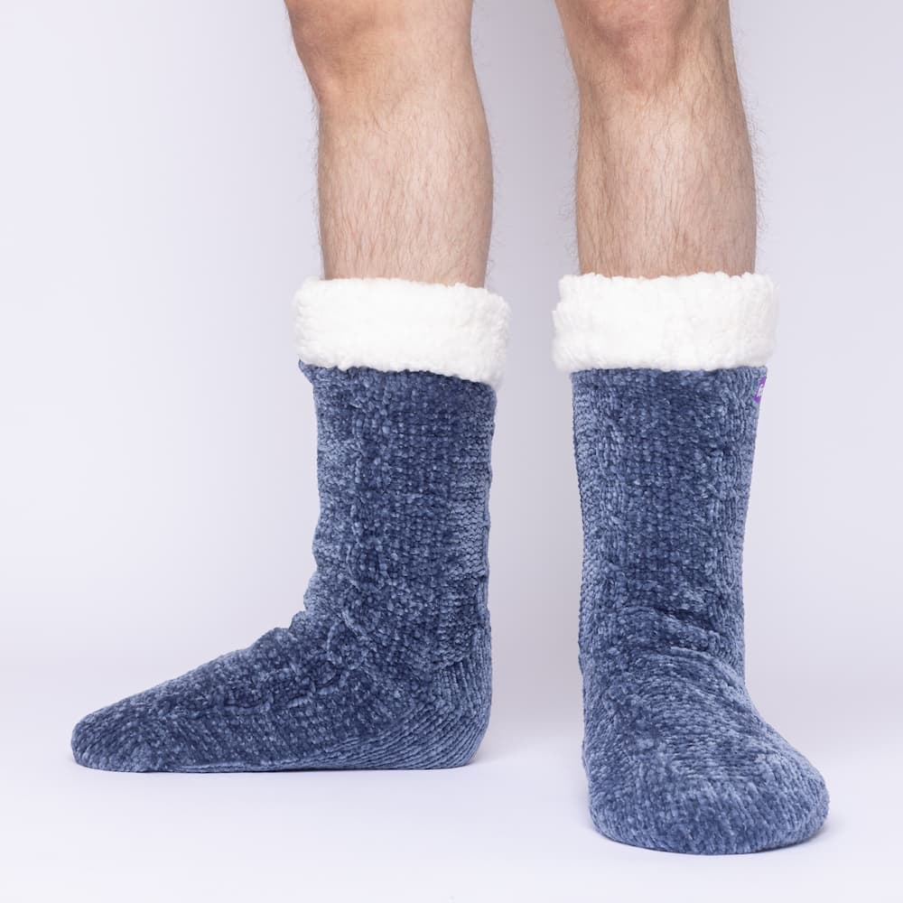 The Foozie™ in Blue, front view of both feet worn by a man in Large with the sherpa cuffs folded down