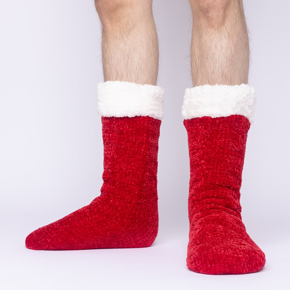 The Foozie™ in Red, front view of both feet worn by a man in Large with the sherpa cuffs folded down