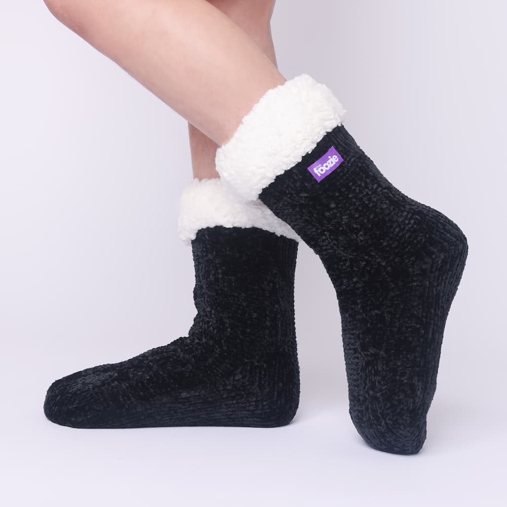 The Foozie™ in Black, side view worn in Kids/Small with the sherpa cuff folded down
