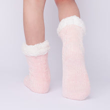 Load image into Gallery viewer, The Foozie™ in Pink, back view worn in Kids/Small with one foot raised to show the sole
