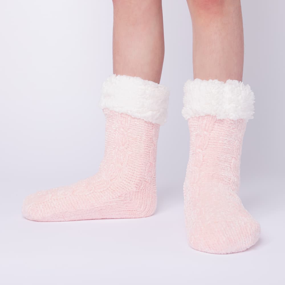 The Foozie™ in Pink, front view of both feet worn in Kids/Small with the sherpa cuffs folded down