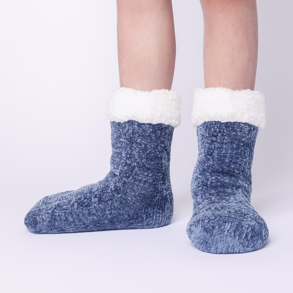 The Foozie™ in Blue, front view of both feet worn in Kids/Small with the sherpa cuffs folded down
