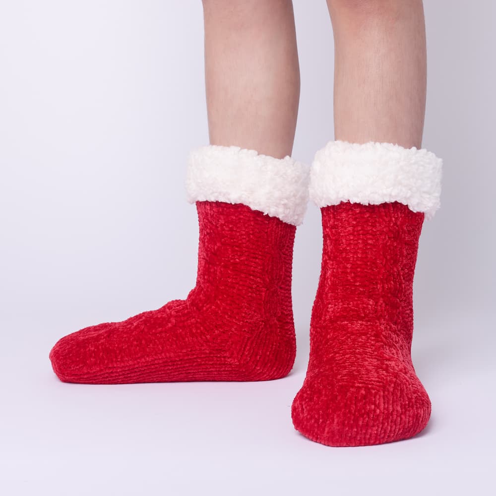 The Foozie™ in Red, front view of both feet worn in Kids/Small with the sherpa cuffs folded down